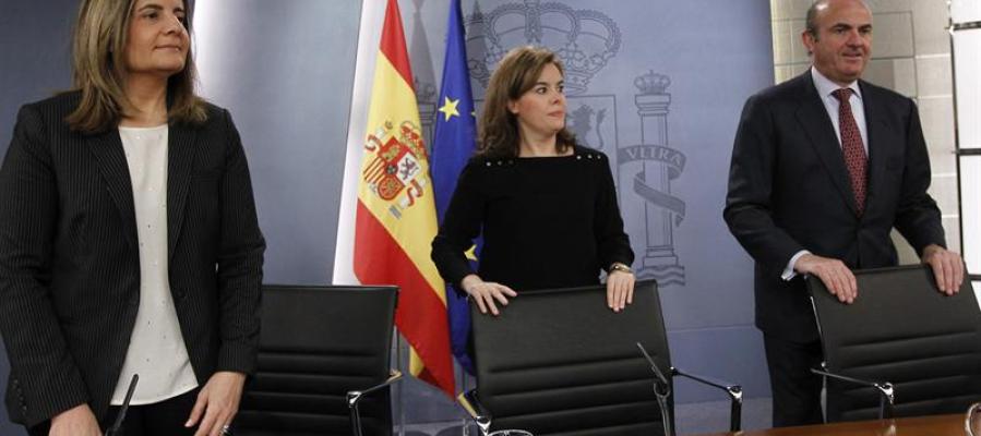 Fátima Báñez, Soraya Sánez de Santamaría y Luis de Guindos Fátima Báñez, Soraya Sánez de Santamaría y Luis de Guindos