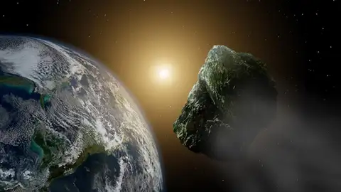 Recreación artística de un asteroide pasando por las cercanías de nuestro planeta Recreación artística de un asteroide pasando por las cercanías de nuestro planeta