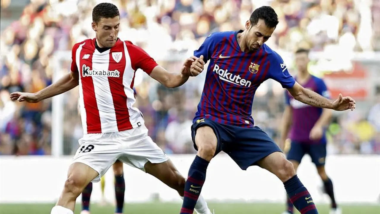 Óscar De Marcos con Busquets.