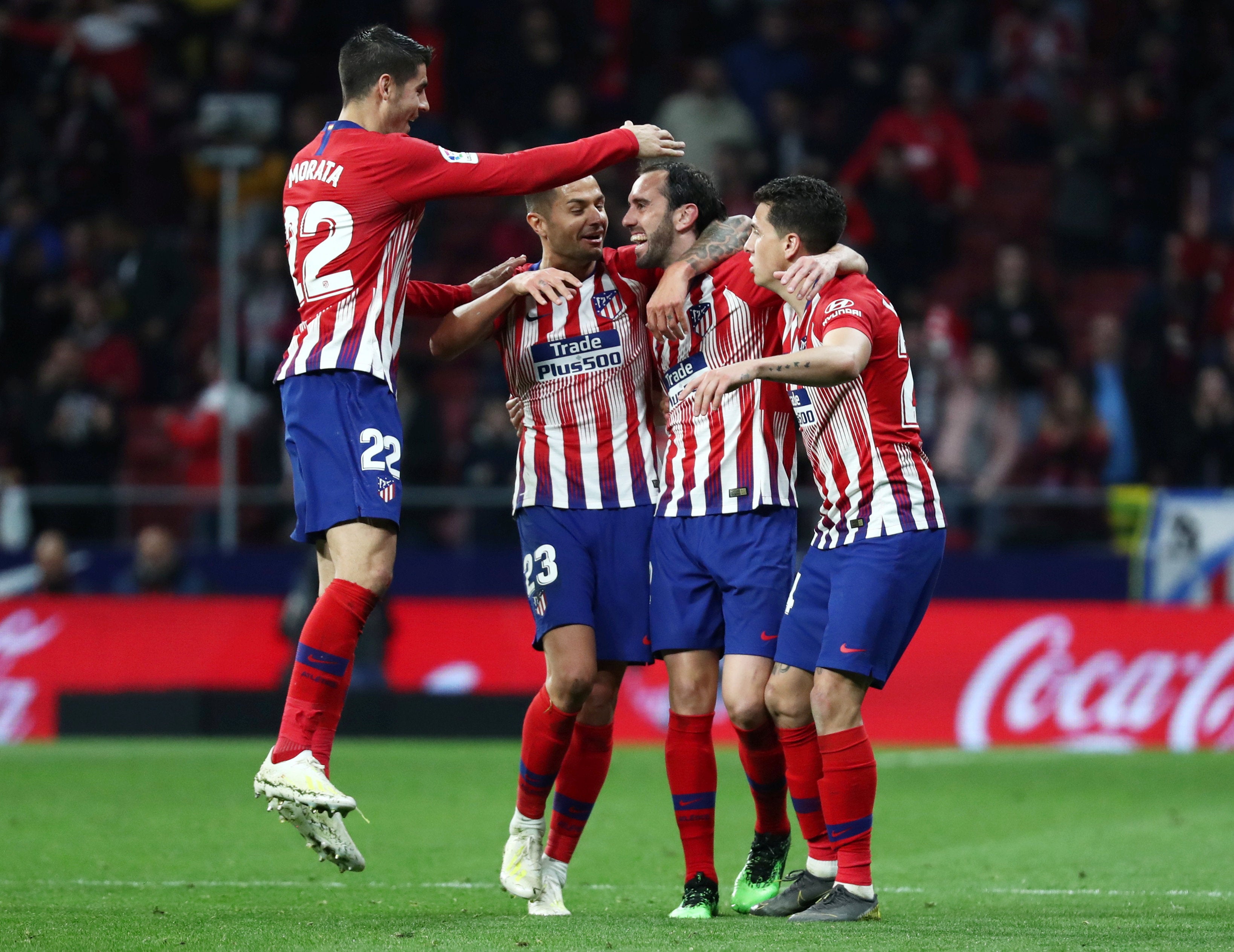Los goles de Godín y Griezmann dan la victoria al Atlético ante el Girona Los goles de Godín y Griezmann dan la victoria al Atlético ante el Girona