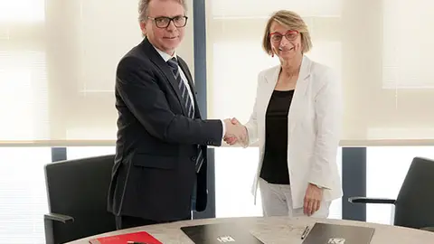 Firma convenio con Tudón abogados .