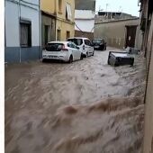 Una calle de Villarrubia de los Ojos inundada de agua