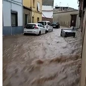 Una calle de Villarrubia de los Ojos inundada de agua Una calle de Villarrubia de los Ojos inundada de agua