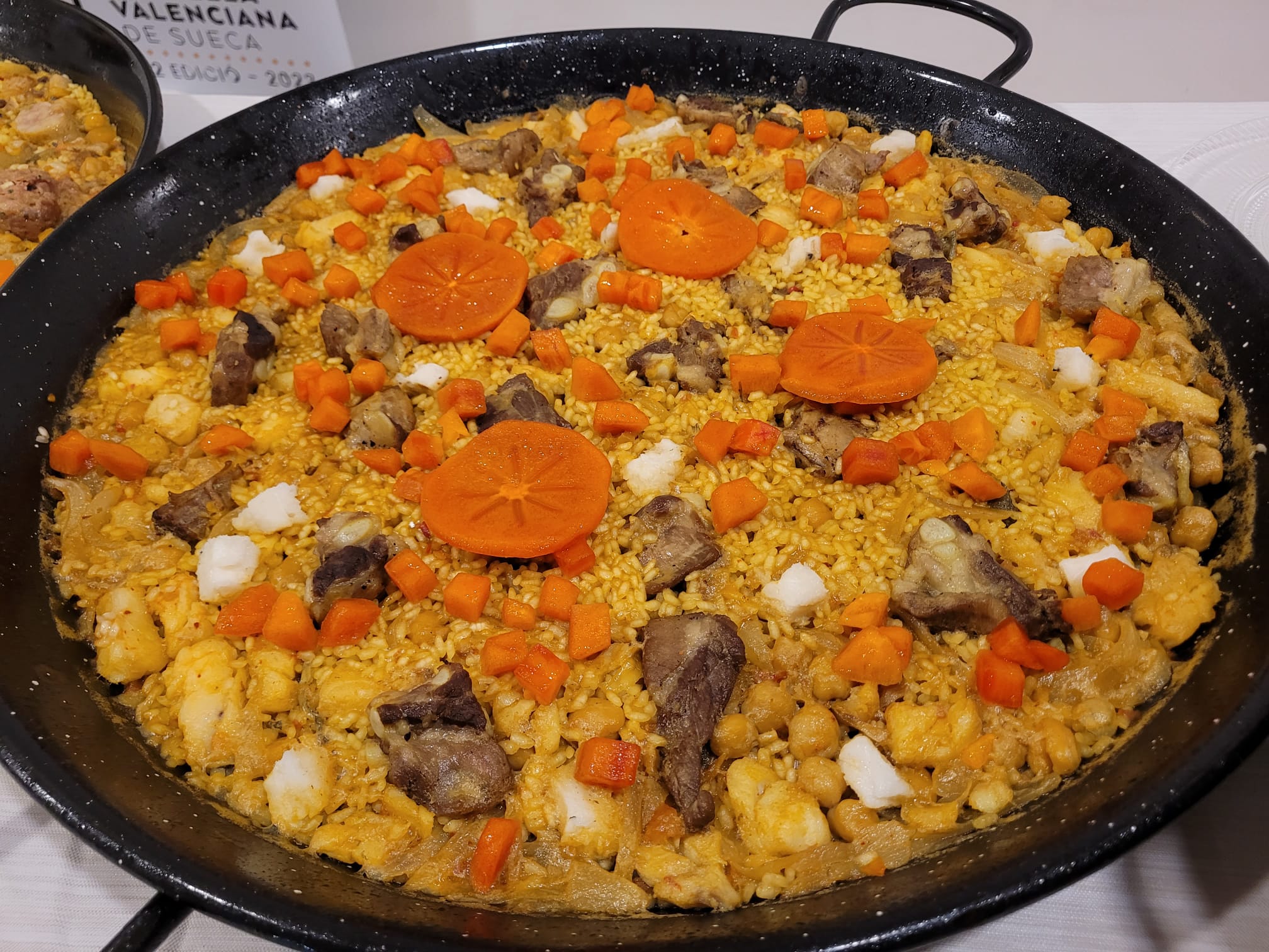 Arròs de la Ribera del Xúquer, una paella con caqui Arròs de la Ribera del Xúquer, una paella con caqui