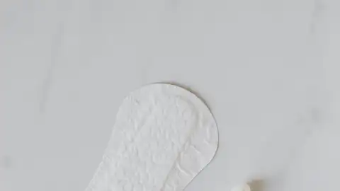 Una compresa y un tampón Una compresa y un tampón