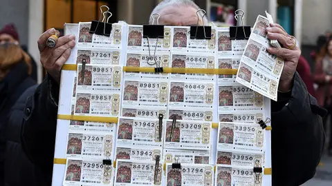 Un vendedor de Lotería de Navidad Un vendedor de Lotería de Navidad