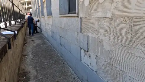 Operarios en la fachada Operarios en la fachada
