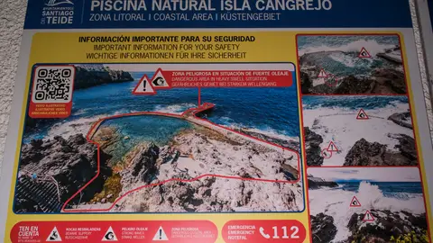 Imagen tomada este domingo del cartel que informa de los peligros con oleaje de la piscina natural de Isla Cangrejo, Imagen tomada este domingo del cartel que informa de los peligros con oleaje de la piscina natural de Isla Cangrejo/ EFE/Alberto Valdés