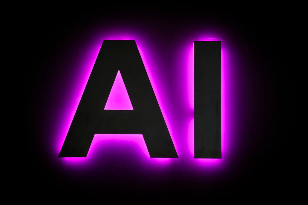 Detalle de un cartel anunciando inteligencia artificial en una feria tecnológica, en una fotografía de archivo. Detalle de un cartel anunciando inteligencia artificial en una feria tecnológica, en una fotografía de archivo.