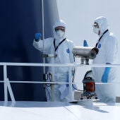 Specialist workers in full PPE onboard the cruise ship MV Hondius after it docked in the Port of Rotterdam to be disinfected following the recent hantavirus outbreak, on May 18, 2026 in Rotterdam, Netherlands.