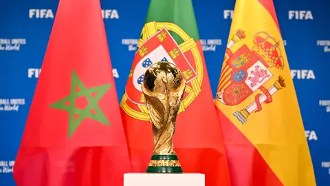 A view of the FIFA World Cup Winner's Trophy with the flags of the FIFA World Cup 2030 hosts Morocco, Portugal and Spain during a trophy shoot at the Home of FIFA on December 11, 2024 in Zurich, Switzerland. A view of the FIFA World Cup Winner's Trophy with the flags of the FIFA World Cup 2030 hosts Morocco, Portugal and Spain during a trophy shoot at the Home of FIFA on December 11, 2024 in Zurich, Switzerland.