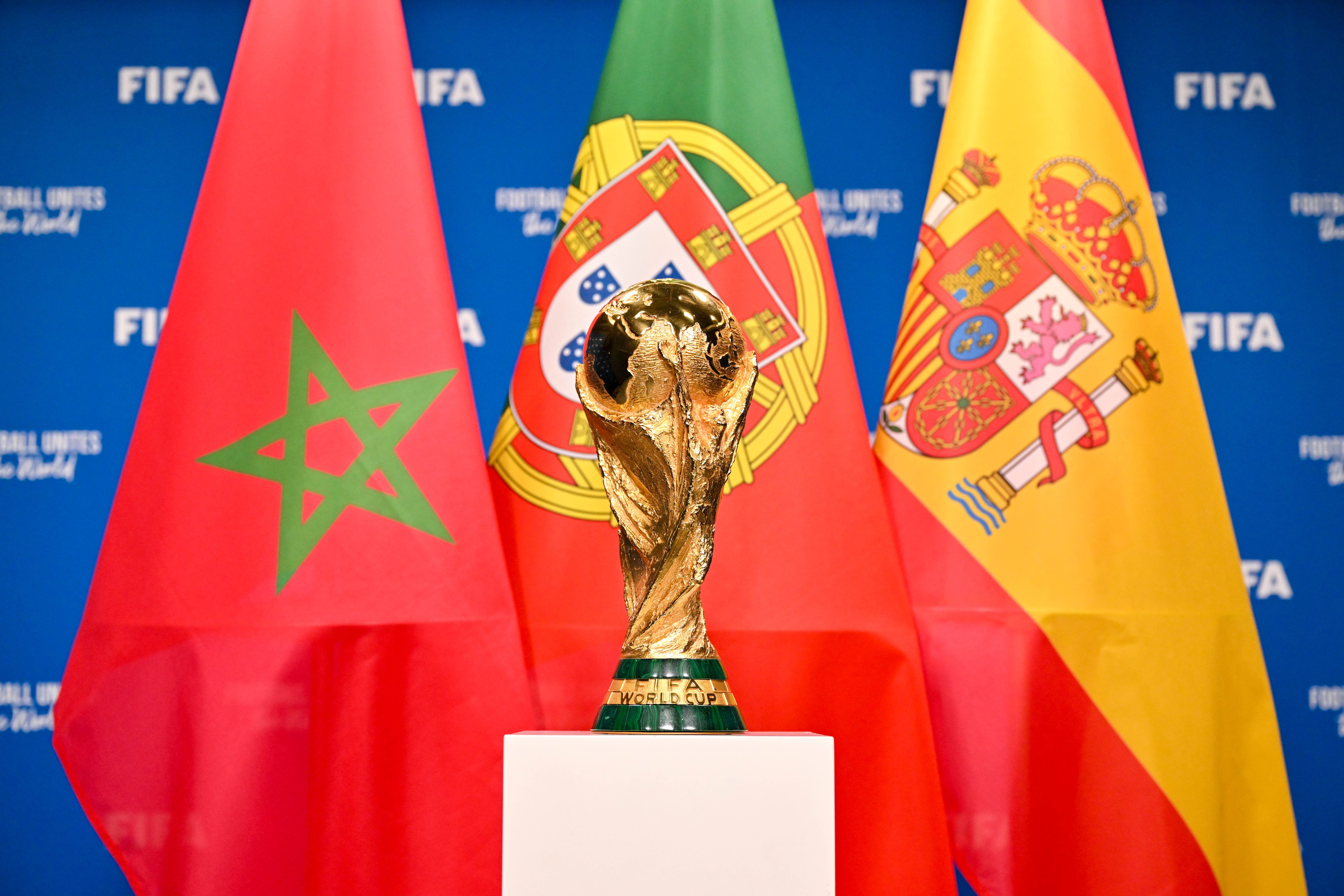 A view of the FIFA World Cup Winner's Trophy with the flags of the FIFA World Cup 2030 hosts Morocco, Portugal and Spain during a trophy shoot at the Home of FIFA on December 11, 2024 in Zurich, Switzerland. A view of the FIFA World Cup Winner's Trophy with the flags of the FIFA World Cup 2030 hosts Morocco, Portugal and Spain during a trophy shoot at the Home of FIFA on December 11, 2024 in Zurich, Switzerland.