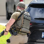 Immigration and Customs Enforcement officers stand outside of a residence on Saint Winfred street after a man who they were pursuing barricaded himself inside the house in Spring, Wednesday, July 8, 2026. Immigration and Customs Enforcement officers stand outside of a residence on Saint Winfred street after a man who they were pursuing barricaded himself inside the house in Spring, Wednesday, July 8, 2026.