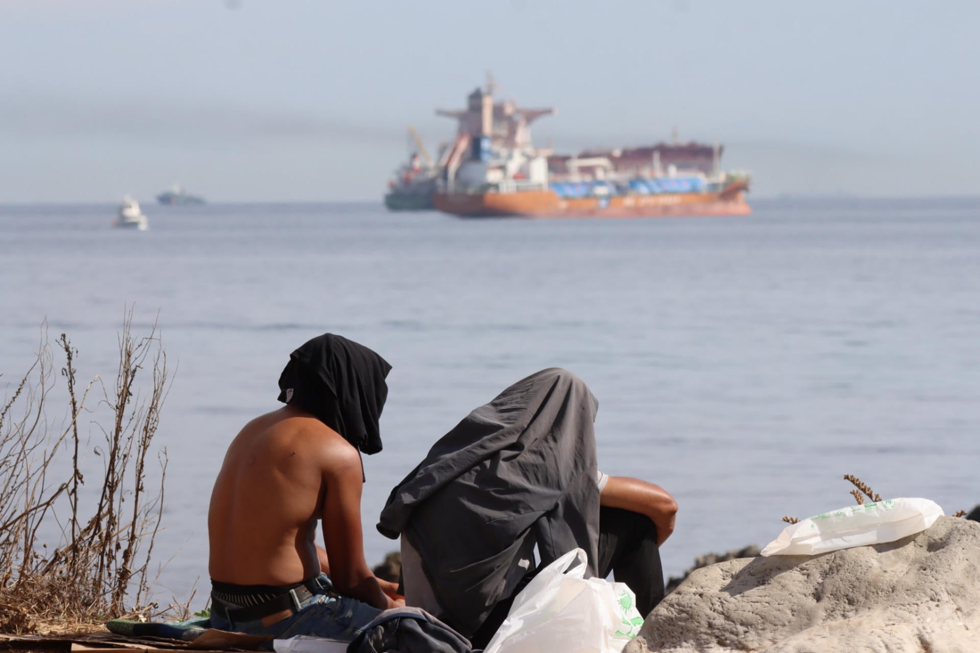 Migrantes en la Playa El Trampolín Migrantes en la Playa El Trampolín