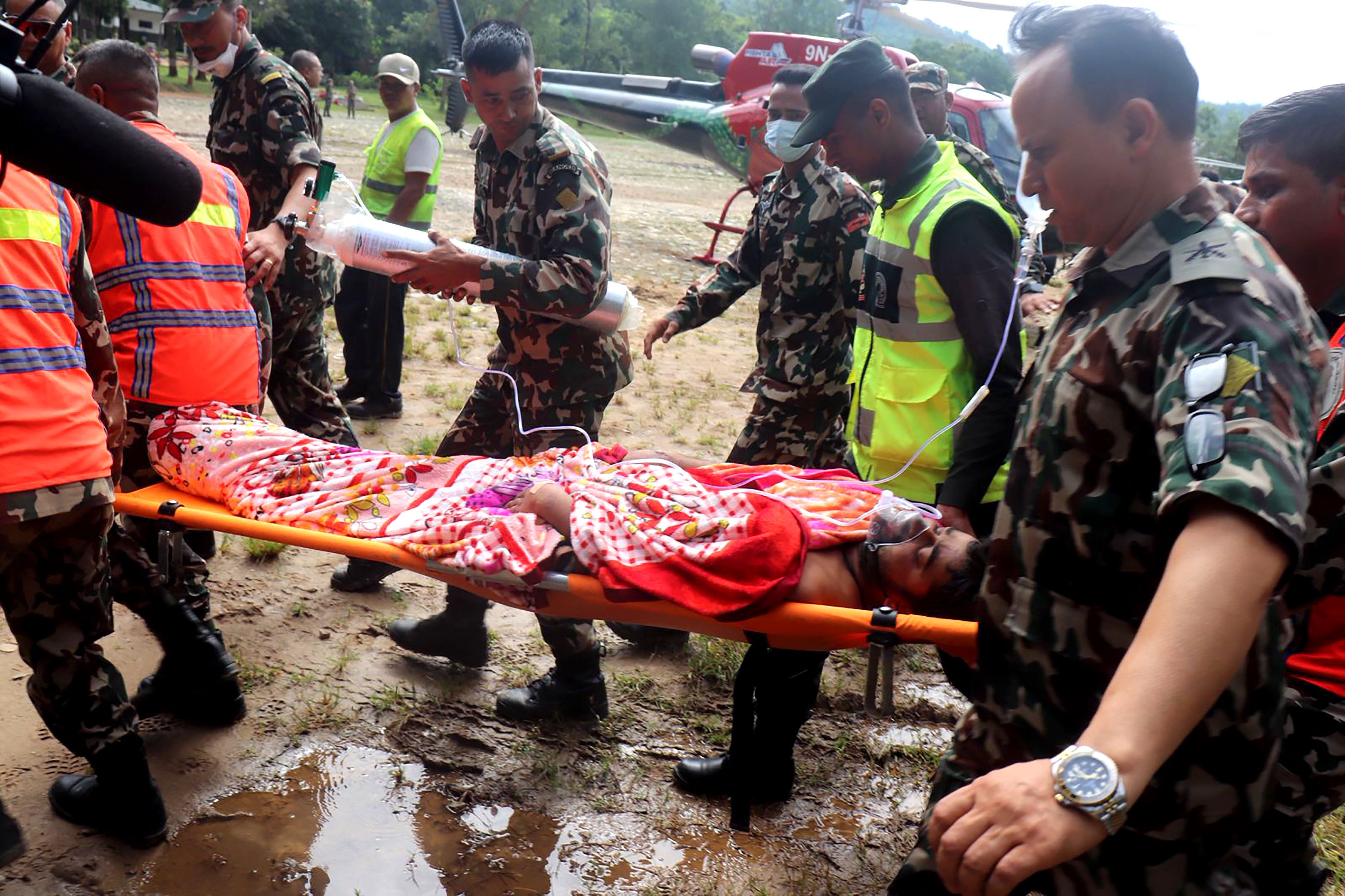 Rescuers transfer a worker rescued alive in Rasuwa district, Nepal, Sept. 4, 2026. Rescuers transfer a worker rescued alive in Rasuwa district, Nepal, Sept. 4, 2026.
