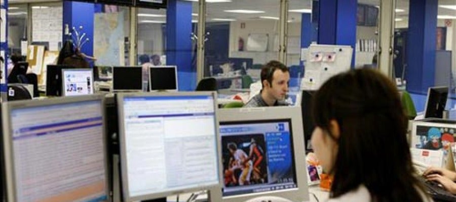 Trabajadores en una oficina Trabajadores en una oficina