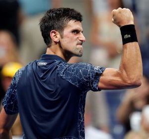 Djokovic celebra un punto contra Millman Djokovic celebra un punto contra Millman