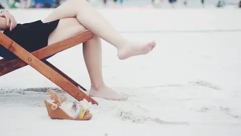 Pies en la arena Playa