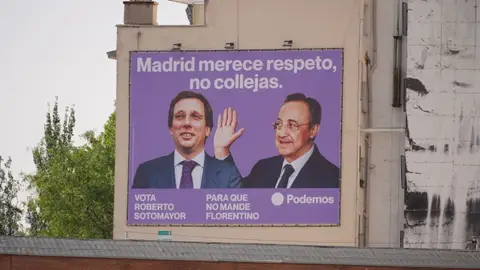 Podemos coloca una lona en Ventas con la imagen de Florentino Pérez pegando una colleja a Almeida Podemos coloca una lona en Ventas con la imagen de Florentino Pérez pegando una colleja a Almeida