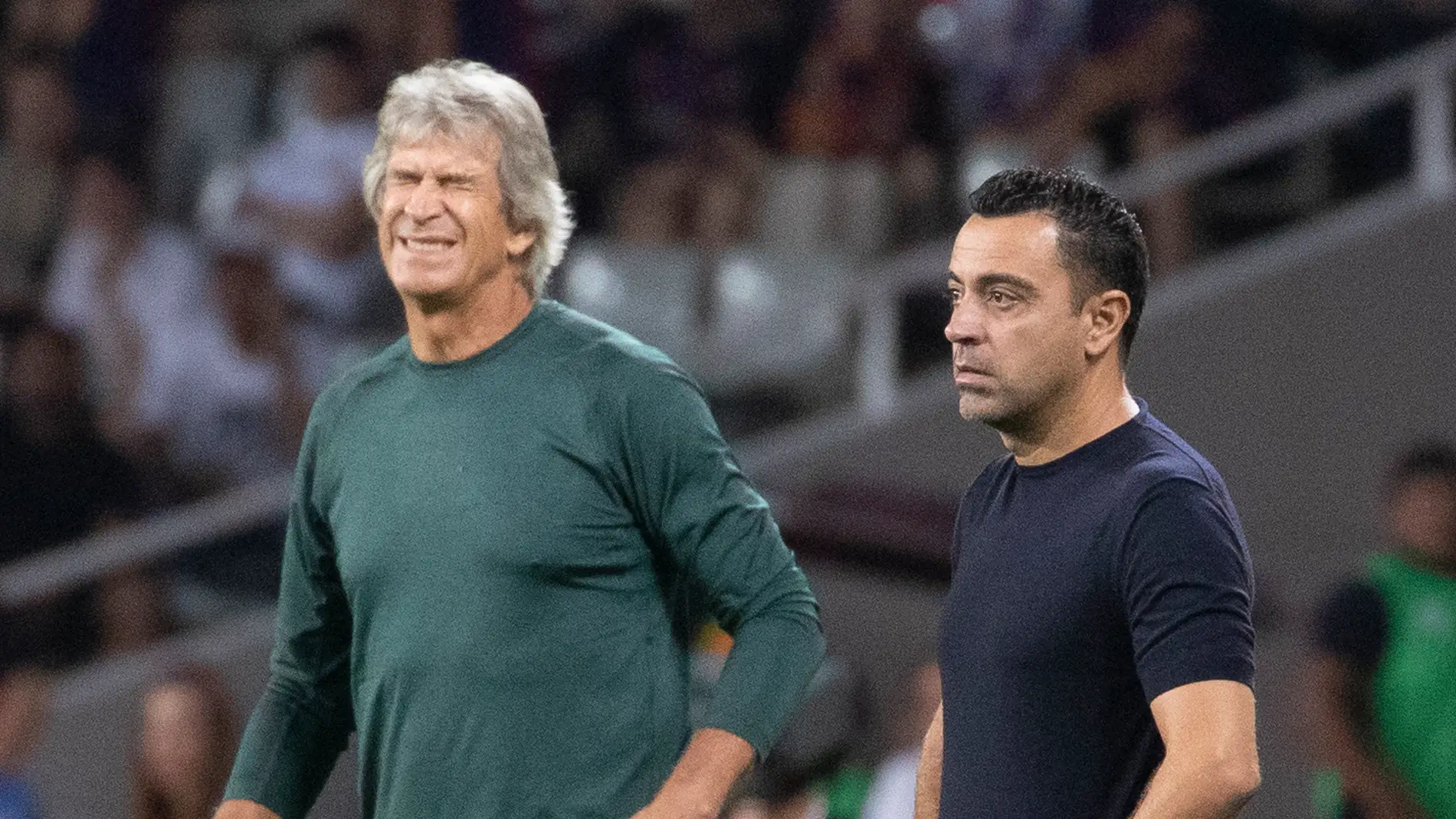 Manuel Pellegrini y Xavi, durante el Barcelona-Betis.