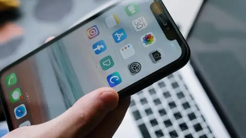 Interfaz de un iPhone con varias aplicaciones. Interfaz de un iPhone con varias aplicaciones.