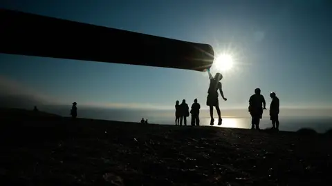 A boy leaps to touch the end of the barrel of a decommissioned 100-year-old Vickers-Armstrong coastal artillery canon on August 11, 2026 in El Monte De San Pedro park ahead of the August 12th total solar eclipse in A Coruna, Spain. A boy leaps to touch the end of the barrel of a decommissioned 100-year-old Vickers-Armstrong coastal artillery canon on August 11, 2026 in El Monte De San Pedro park ahead of the August 12th total solar eclipse in A Coruna, Spain.