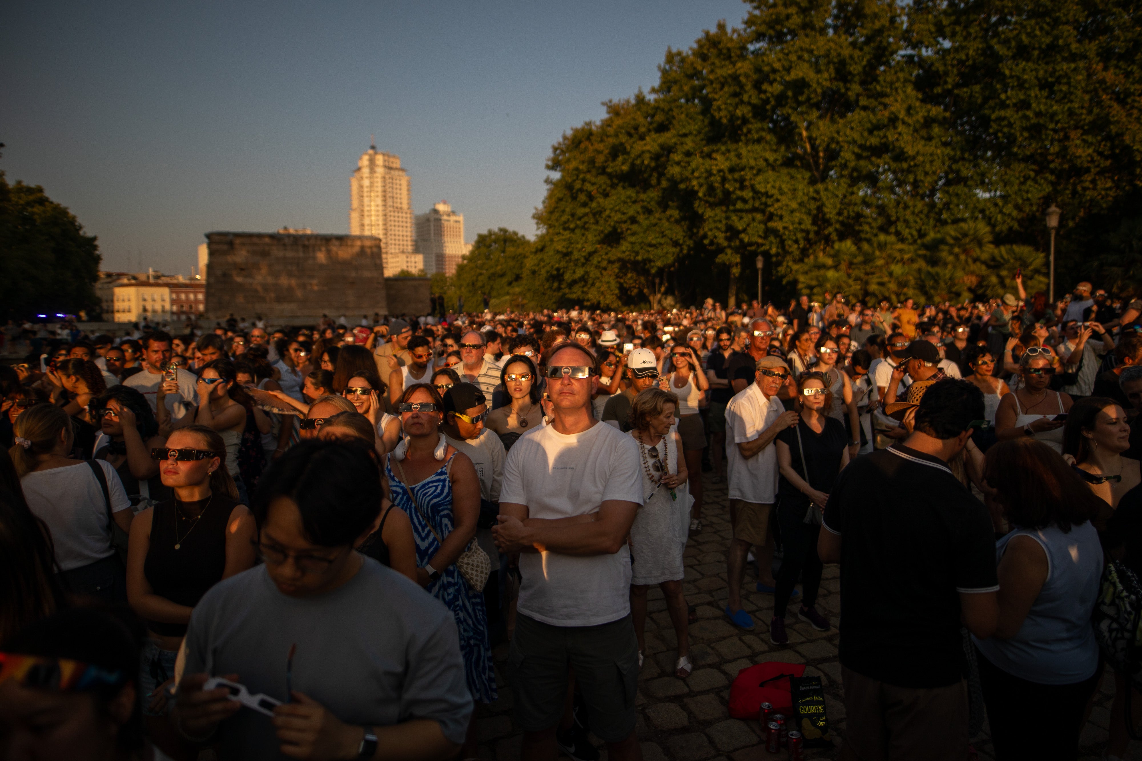 Hundreds of people gather to view the solar eclipse at the Debod Temple in Madrid, Spain, on August 12, 2026. Hundreds of people gather to view the solar eclipse at the Debod Temple in Madrid, Spain, on August 12, 2026.
